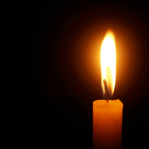 Candle shining in the dark